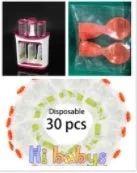 Baby food Squeeze Station machine with 4oz pouches and spoons on a table