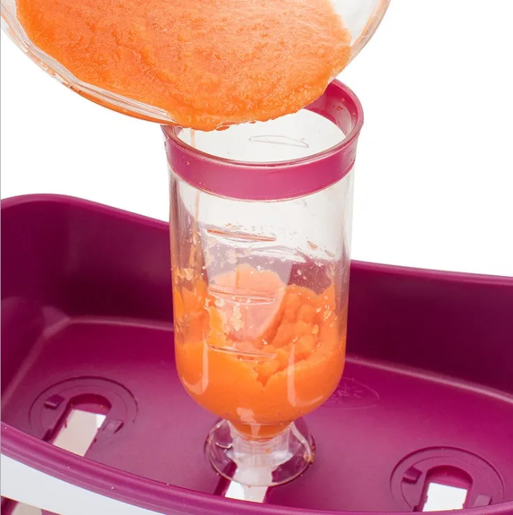 Baby food Squeeze Station machine with 4oz pouches and spoons on a table