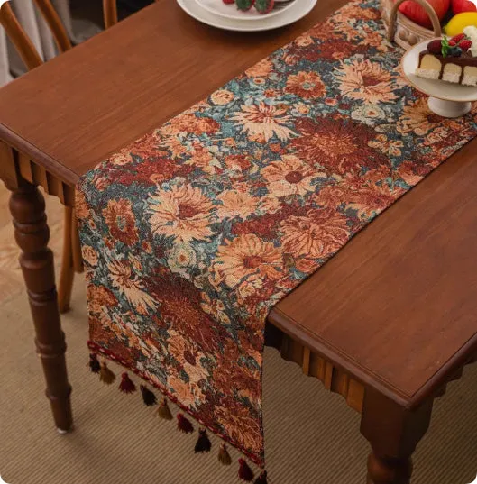 European retro style long table flag with handwoven tassels draped over a wooden sideboard