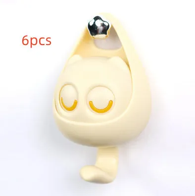 Cream white cat-shaped adhesive wall hook with winking eyes, 2.5kg capacity, 105x61x45mm