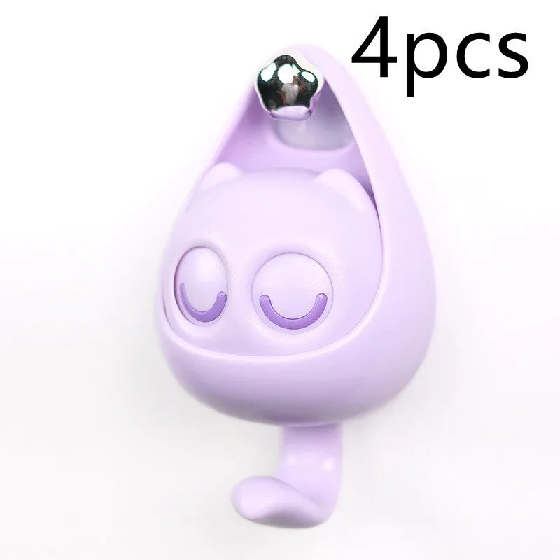 Cream white cat-shaped adhesive wall hook with winking eyes, 2.5kg capacity, 105x61x45mm