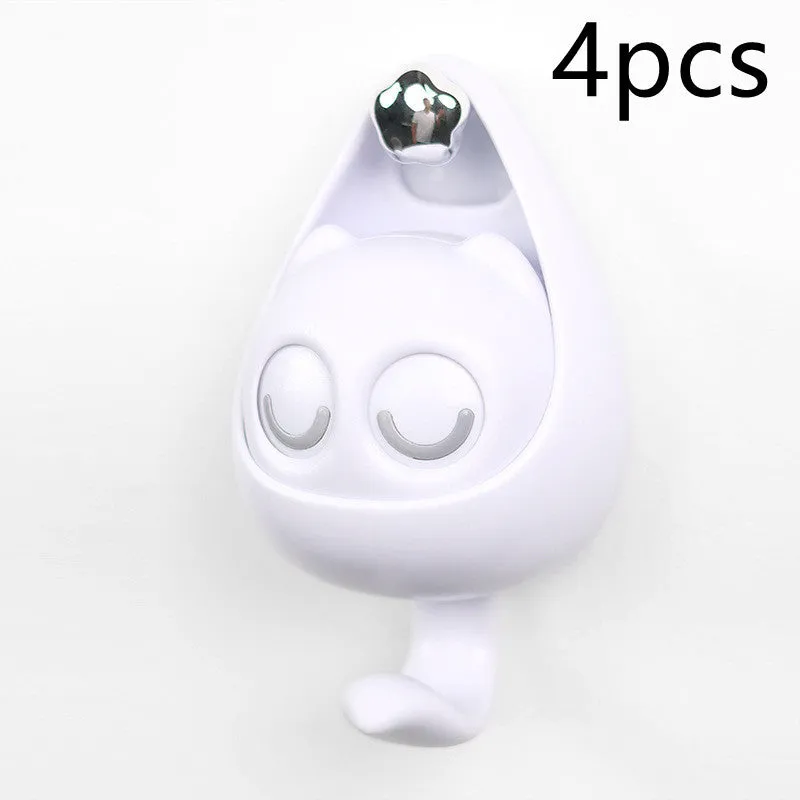 Cream white cat-shaped adhesive wall hook with winking eyes, 2.5kg capacity, 105x61x45mm