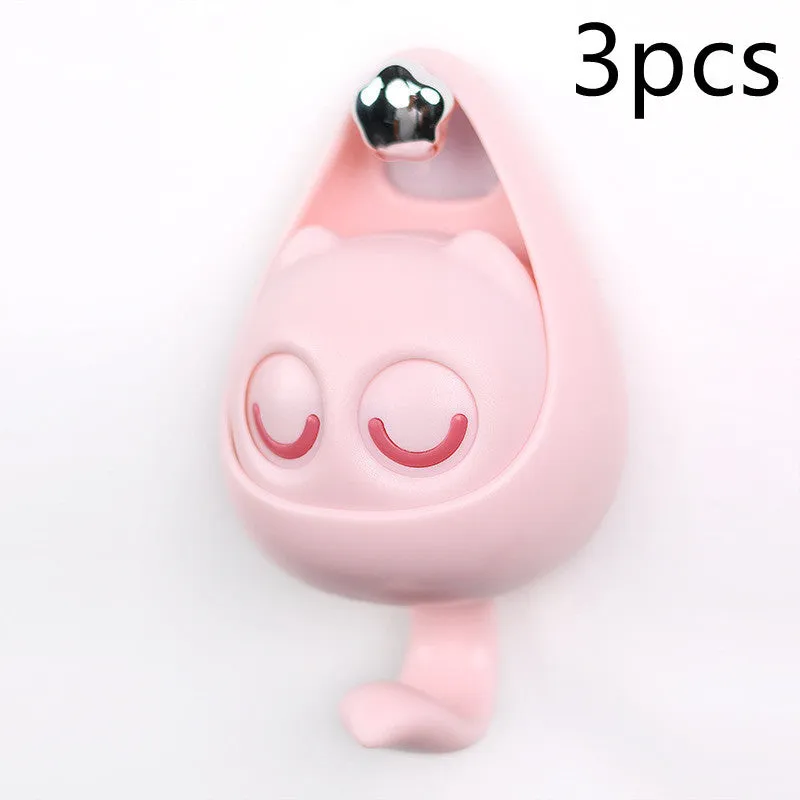 Cream white cat-shaped adhesive wall hook with winking eyes, 2.5kg capacity, 105x61x45mm