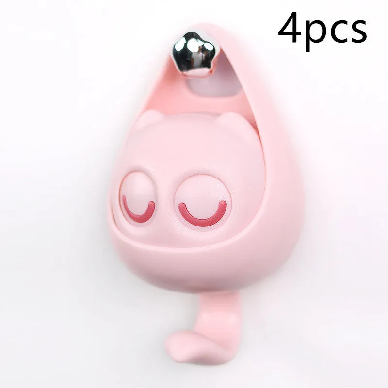 Cream white cat-shaped adhesive wall hook with winking eyes, 2.5kg capacity, 105x61x45mm