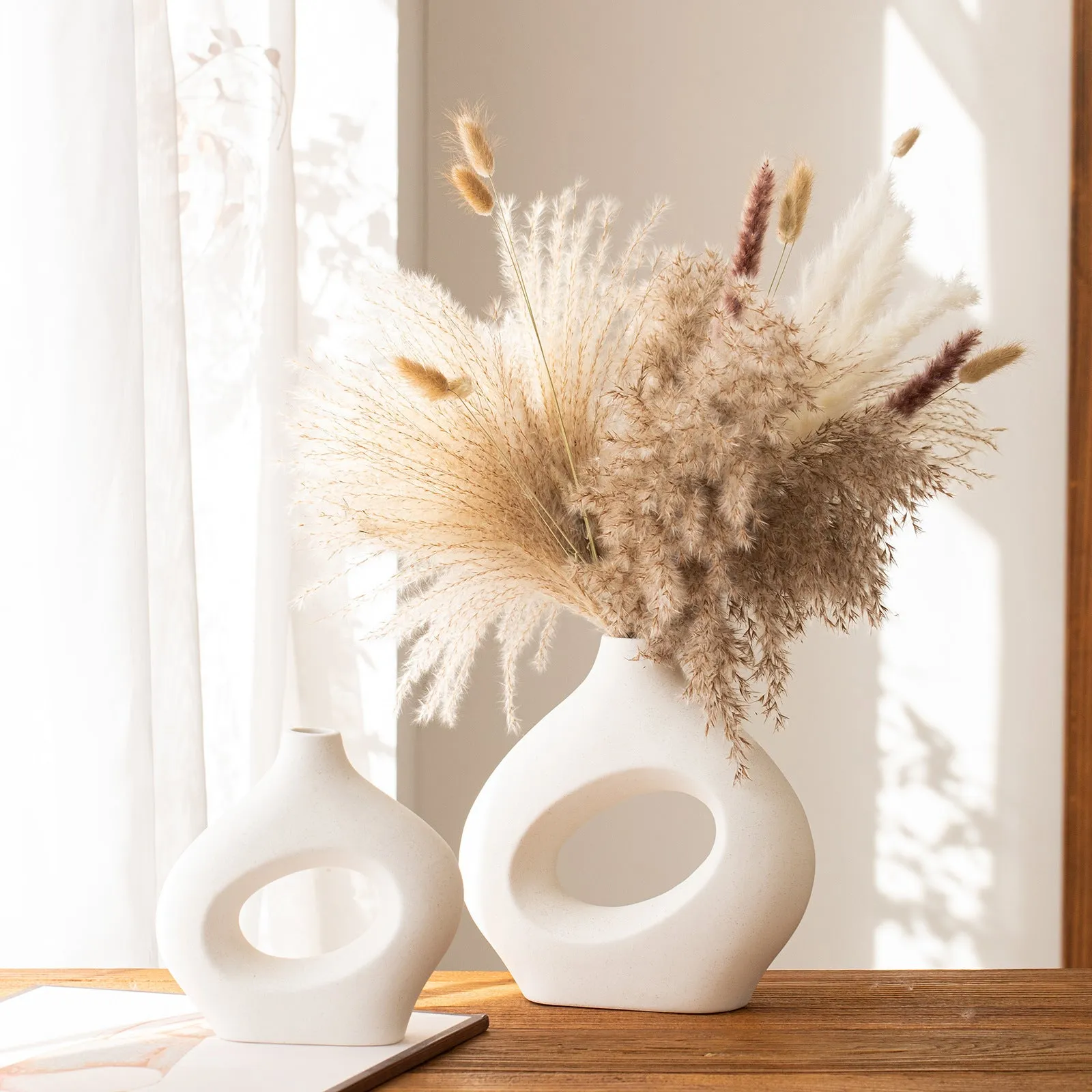 Ceramic soft vase second generation, handmade glazed, white large size on a table as decorative centrepiece