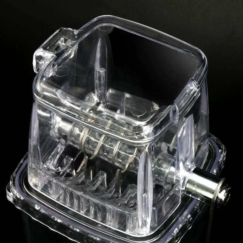 Manual ice crusher with transparent plastic body and stainless steel blade on a kitchen counter