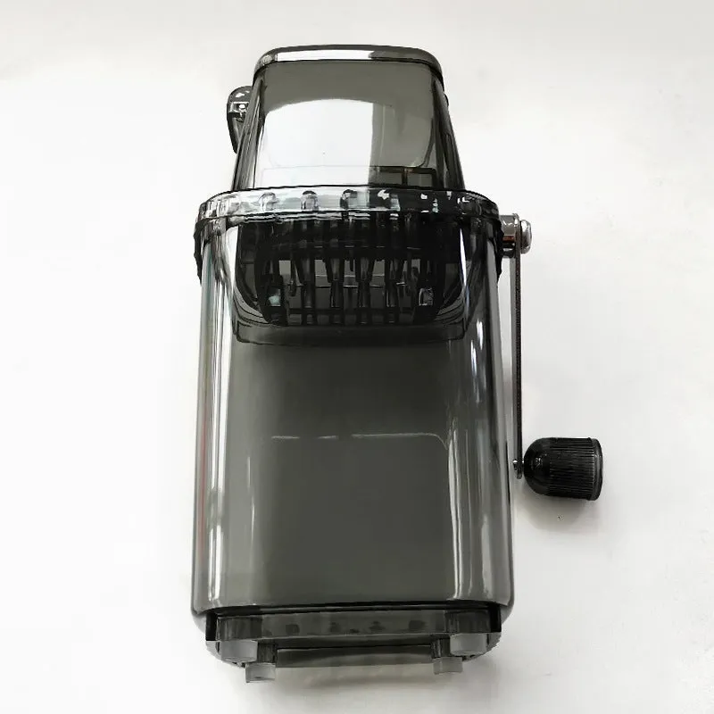 Manual ice crusher with transparent plastic body and stainless steel blade on a kitchen counter