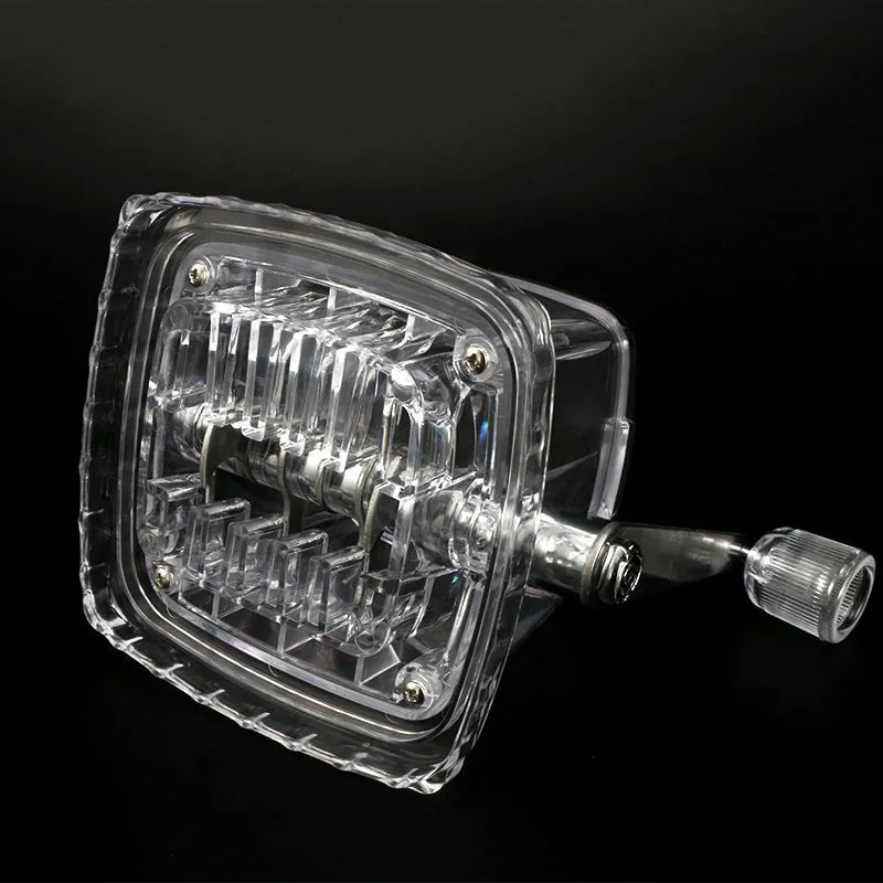 Manual ice crusher with transparent plastic body and stainless steel blade on a kitchen counter