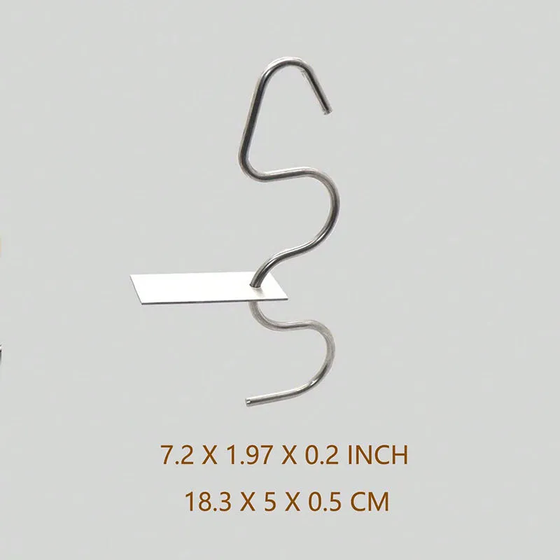 Stainless steel peanut butter mixer stirring rod on a kitchen counter with a jar of peanut butter