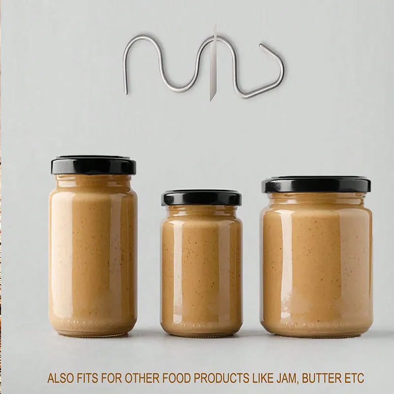 Stainless steel peanut butter mixer stirring rod on a kitchen counter with a jar of peanut butter