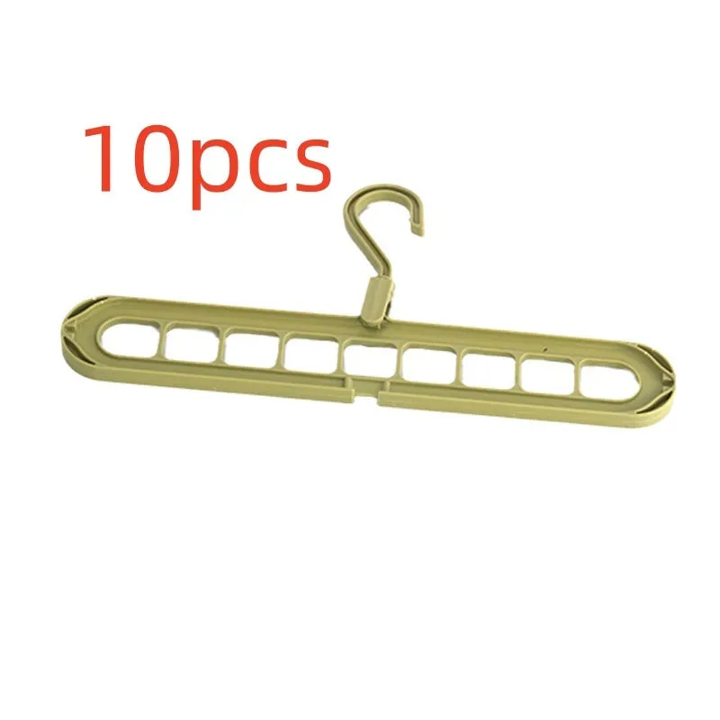 A green plastic folding hanger with nine holes for holding trousers or skirts.
