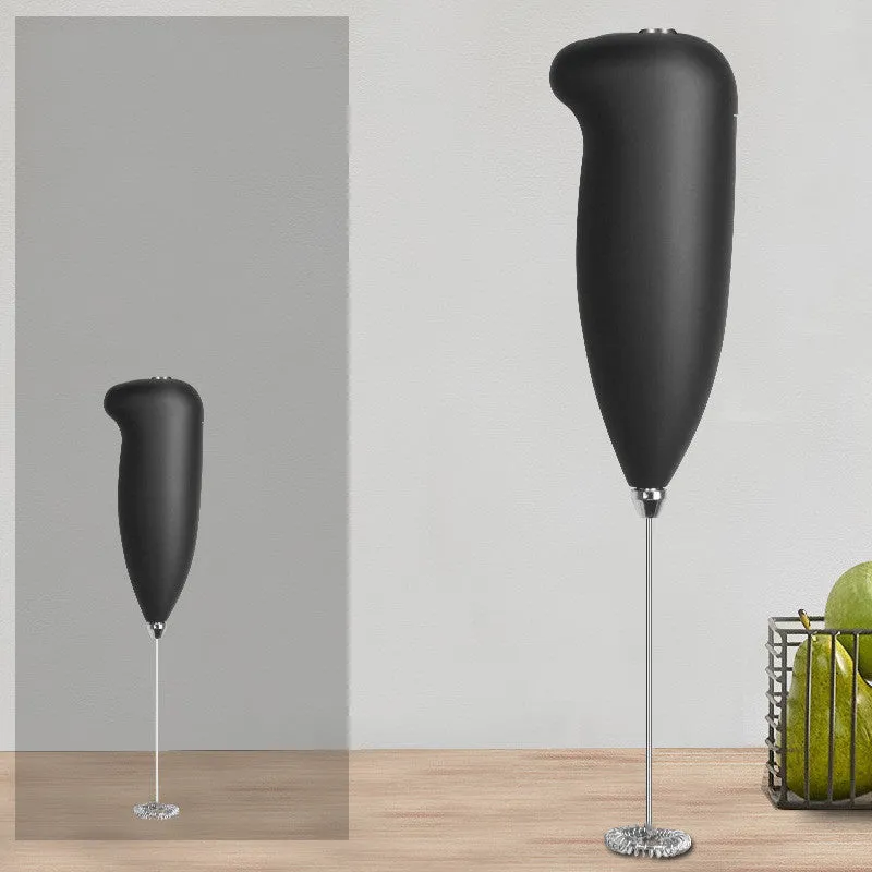 Home mini electric plastic milk frother in black on white background, 5x3x21cm