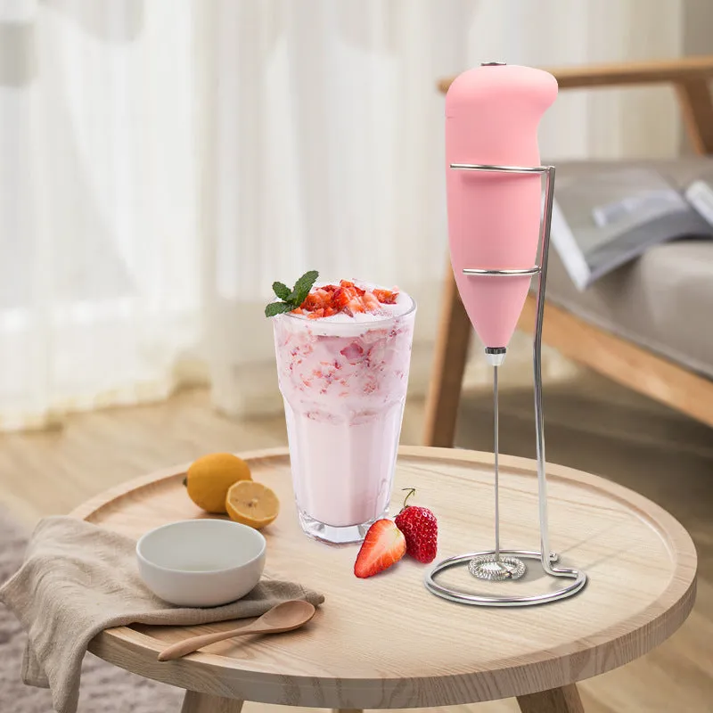 Home mini electric plastic milk frother in black on white background, 5x3x21cm
