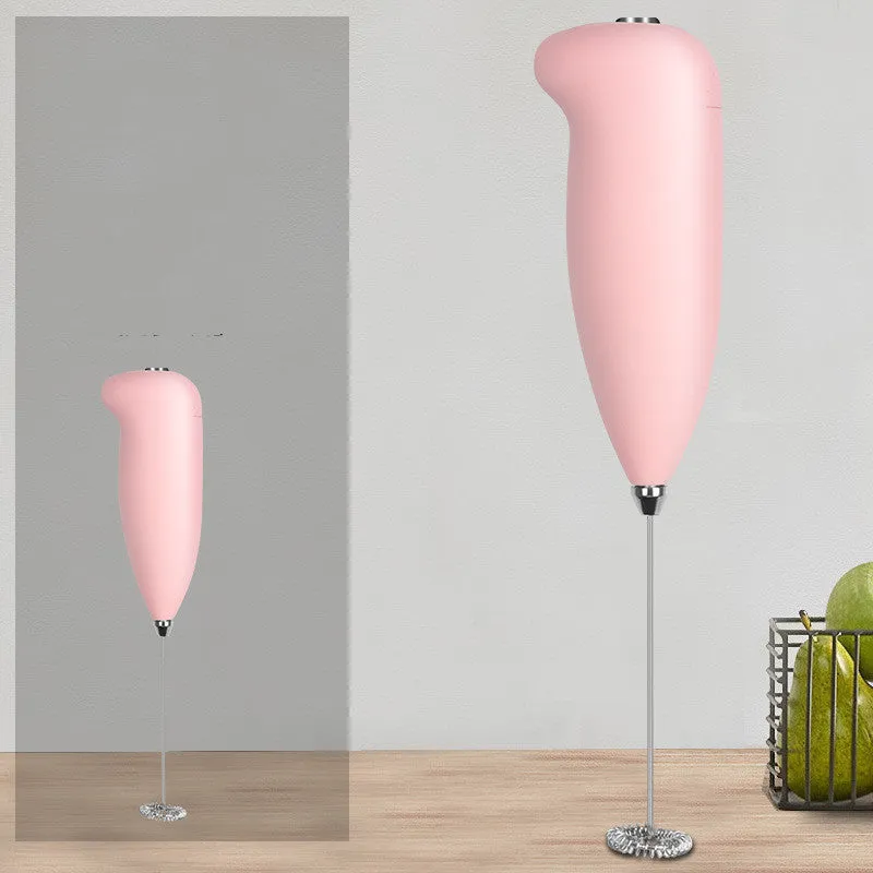 Home mini electric plastic milk frother in black on white background, 5x3x21cm