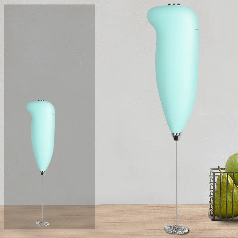 Home mini electric plastic milk frother in black on white background, 5x3x21cm