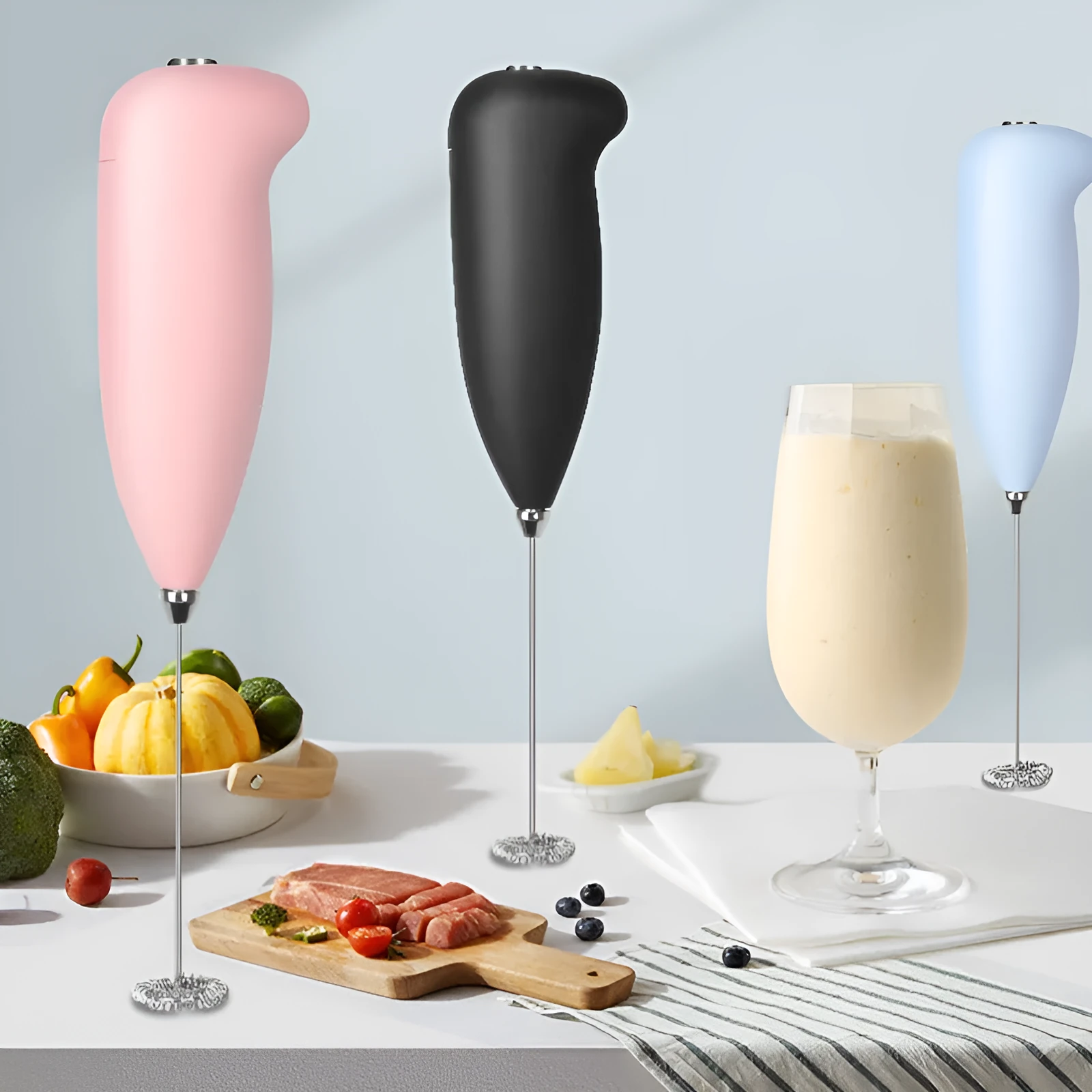 Home mini electric plastic milk frother in black on white background, 5x3x21cm