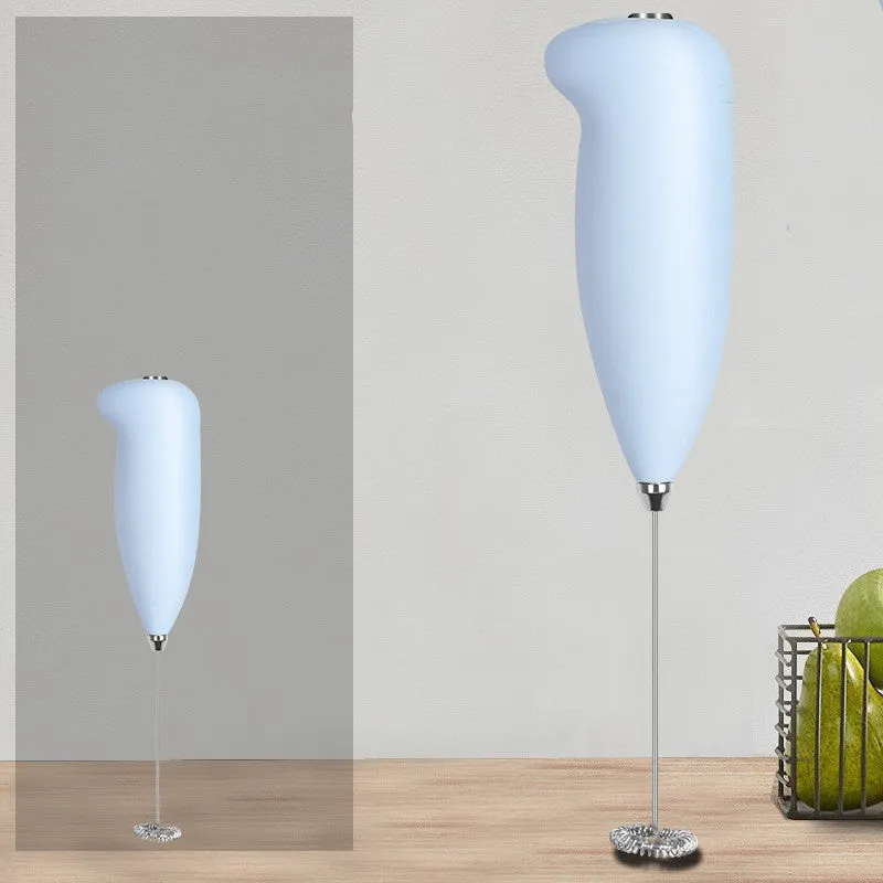 Home mini electric plastic milk frother in black on white background, 5x3x21cm
