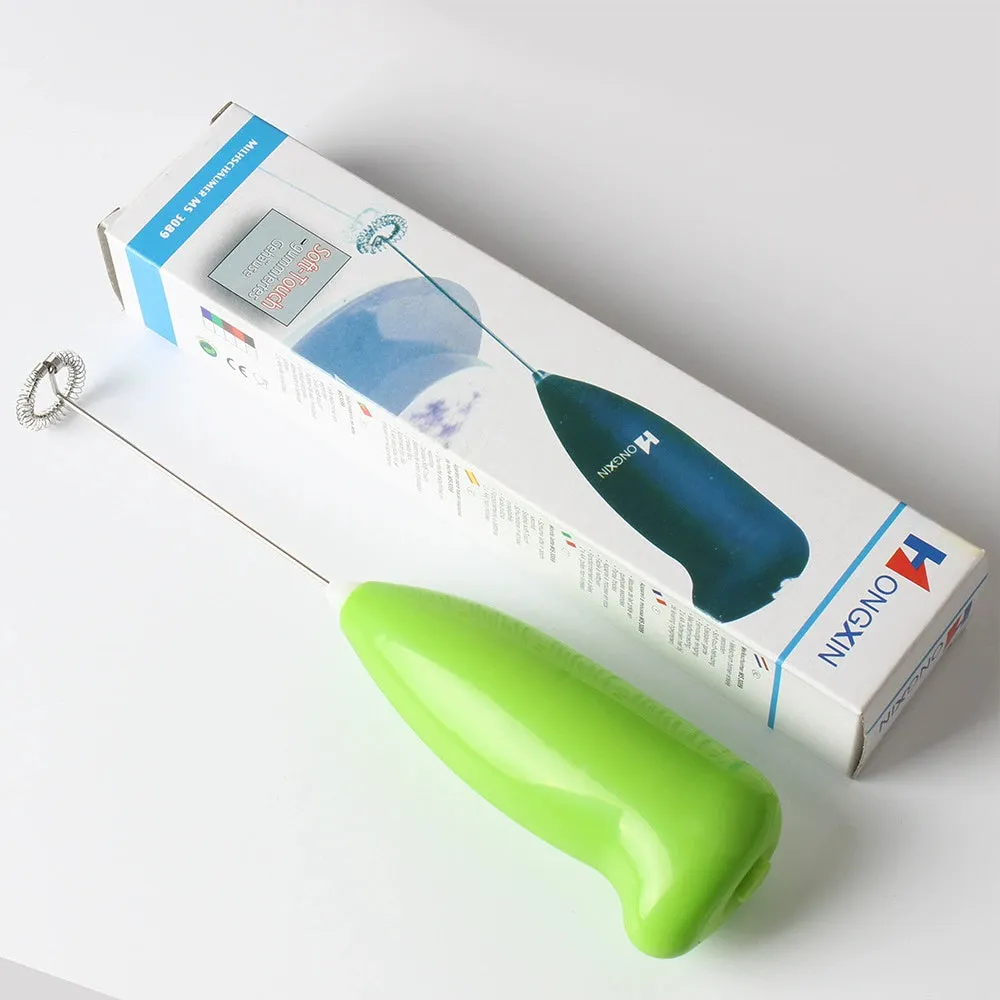 Home mini electric plastic milk frother in black on white background, 5x3x21cm