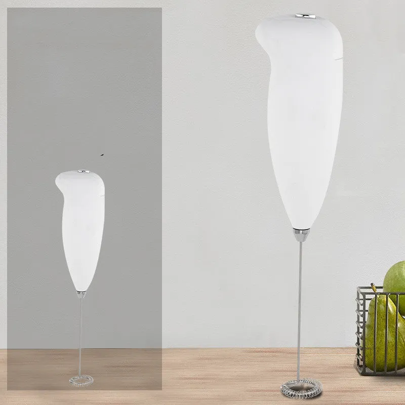 Home mini electric plastic milk frother in black on white background, 5x3x21cm