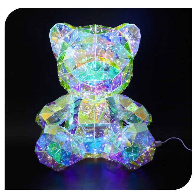 Illusory Glow Christmas Tree decoration in PET material with USB cable, glowing on a festive tabletop