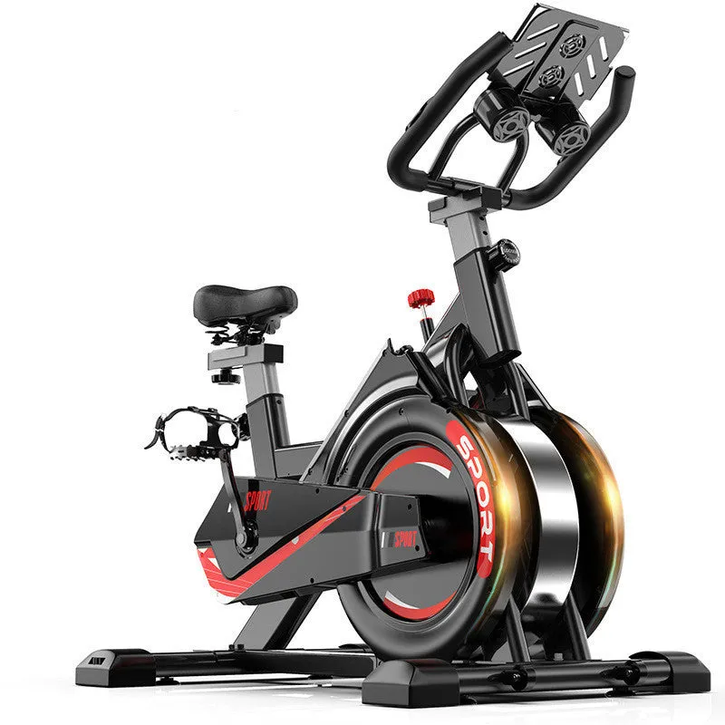 Black upright spinning bike with padded saddle and handlebars for home fitness