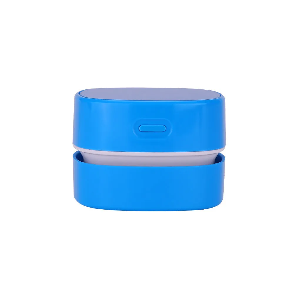 Desktop vacuum cleaner in blue with two-in-one brush nozzle on a desk