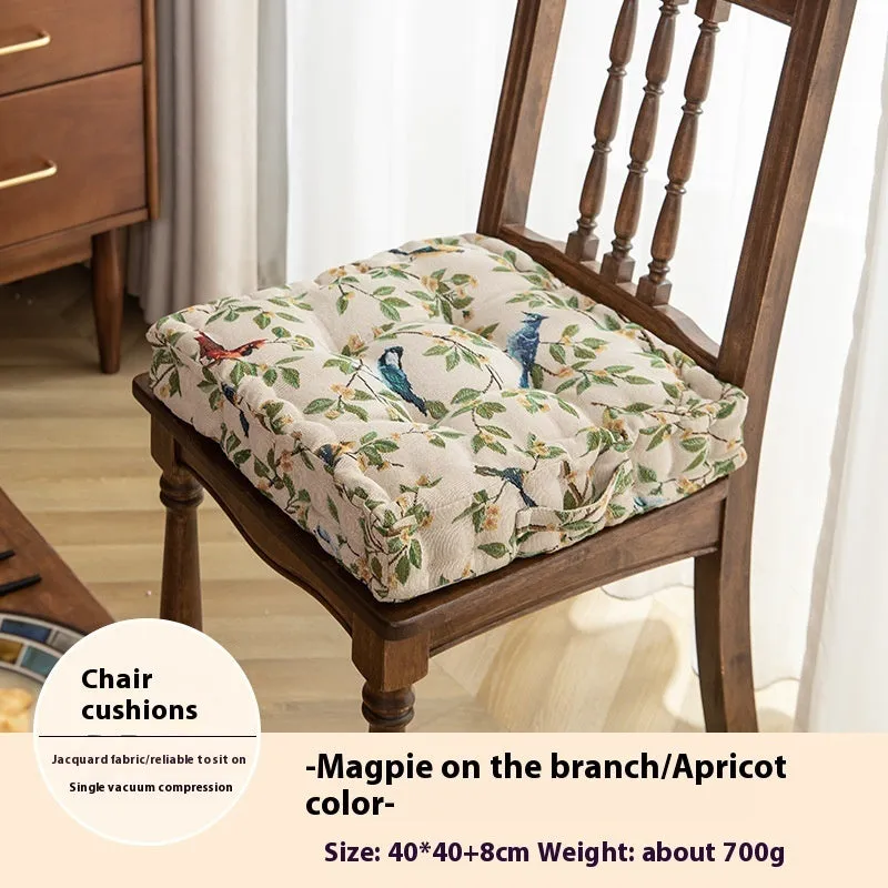 Square American-style dining chair cushion with pp cotton filler, shown in apricot floral bird print.
