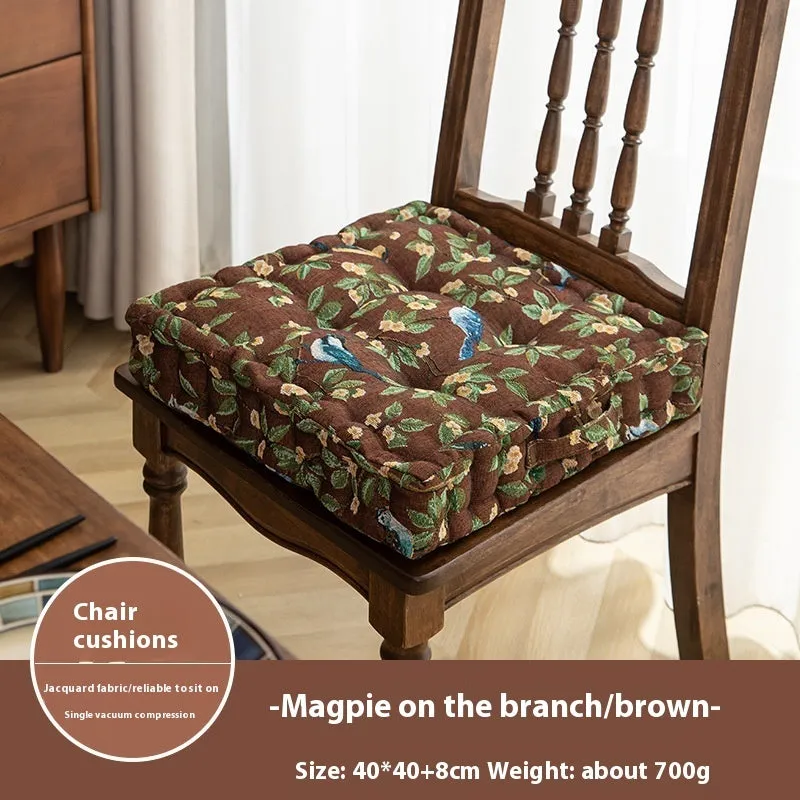 Square American-style dining chair cushion with pp cotton filler, shown in apricot floral bird print.
