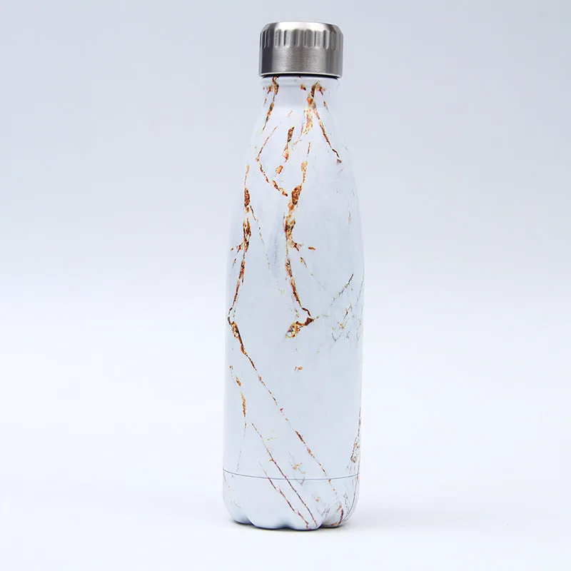 500ml stainless steel vacuum insulated sport bottle with lid on a gym bench