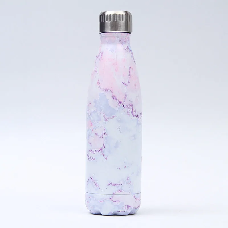 500ml stainless steel vacuum insulated sport bottle with lid on a gym bench