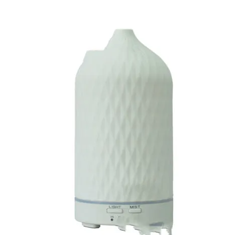 Ceramic aroma diffuser humidifier with 160ml tank, white ceramic finish, single mist outlet, on a wooden table.