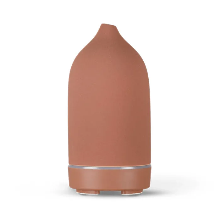 Ceramic aroma diffuser humidifier with 160ml tank, white ceramic finish, single mist outlet, on a wooden table.