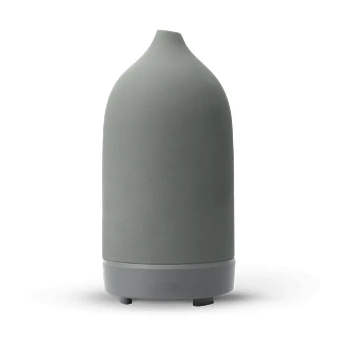 Ceramic aroma diffuser humidifier with 160ml tank, white ceramic finish, single mist outlet, on a wooden table.