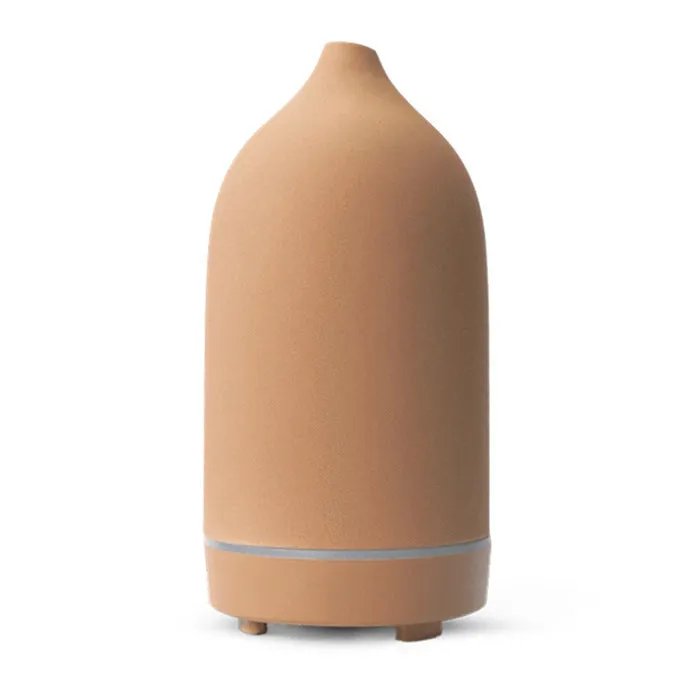 Ceramic aroma diffuser humidifier with 160ml tank, white ceramic finish, single mist outlet, on a wooden table.