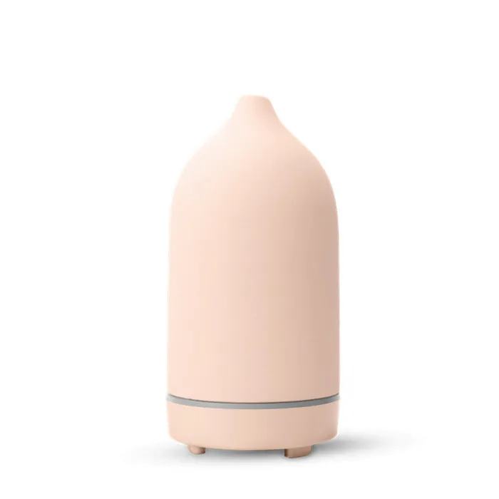 Ceramic aroma diffuser humidifier with 160ml tank, white ceramic finish, single mist outlet, on a wooden table.