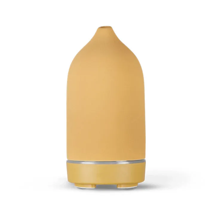 Ceramic aroma diffuser humidifier with 160ml tank, white ceramic finish, single mist outlet, on a wooden table.