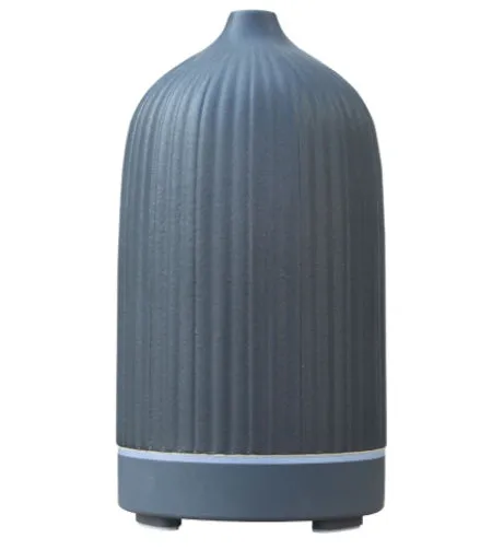 Ceramic aroma diffuser humidifier with 160ml tank, white ceramic finish, single mist outlet, on a wooden table.