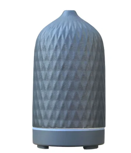 Ceramic aroma diffuser humidifier with 160ml tank, white ceramic finish, single mist outlet, on a wooden table.