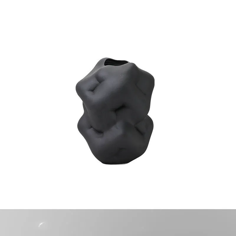 Ceramic flower vase with irregular concave-convex surface in white, 26x25x34cm, on a wooden table