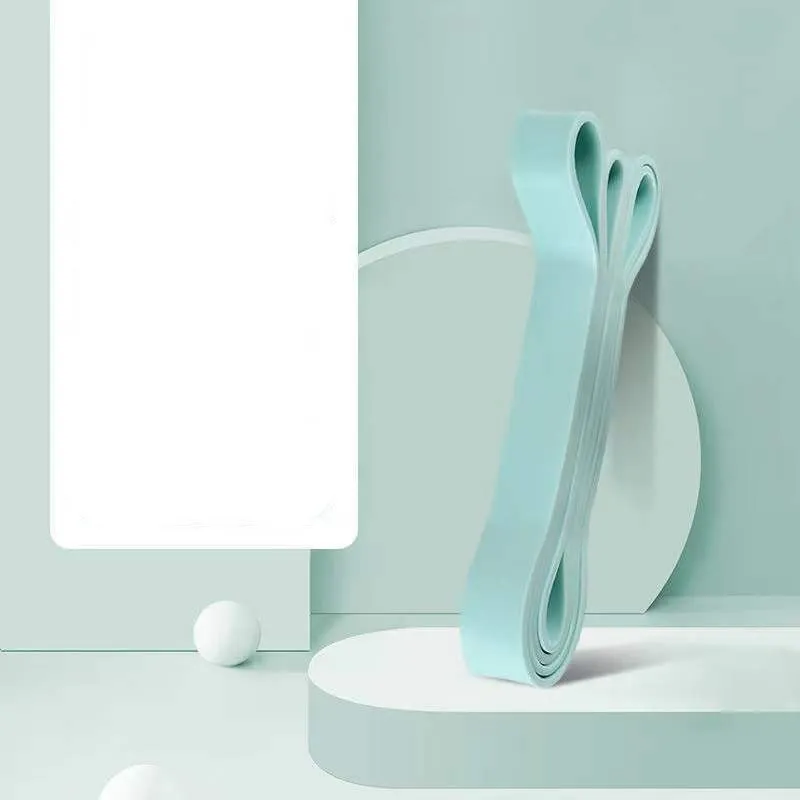 Set of five TPR stretch resistance bands in light blue, grey, pink, fruit green, and dark blue on a white background
