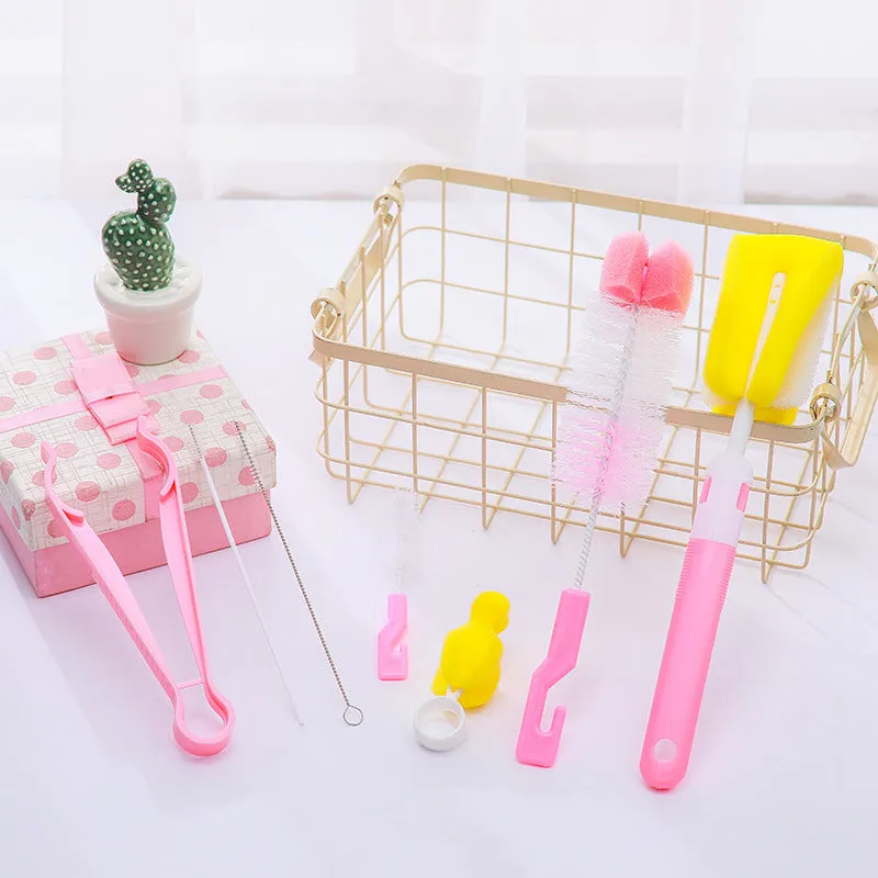 Orange Belle seven-piece bottle brush set in blue and pink includes sponge brush, nylon brush, nipple brushes, straw brushes, and bottle holder