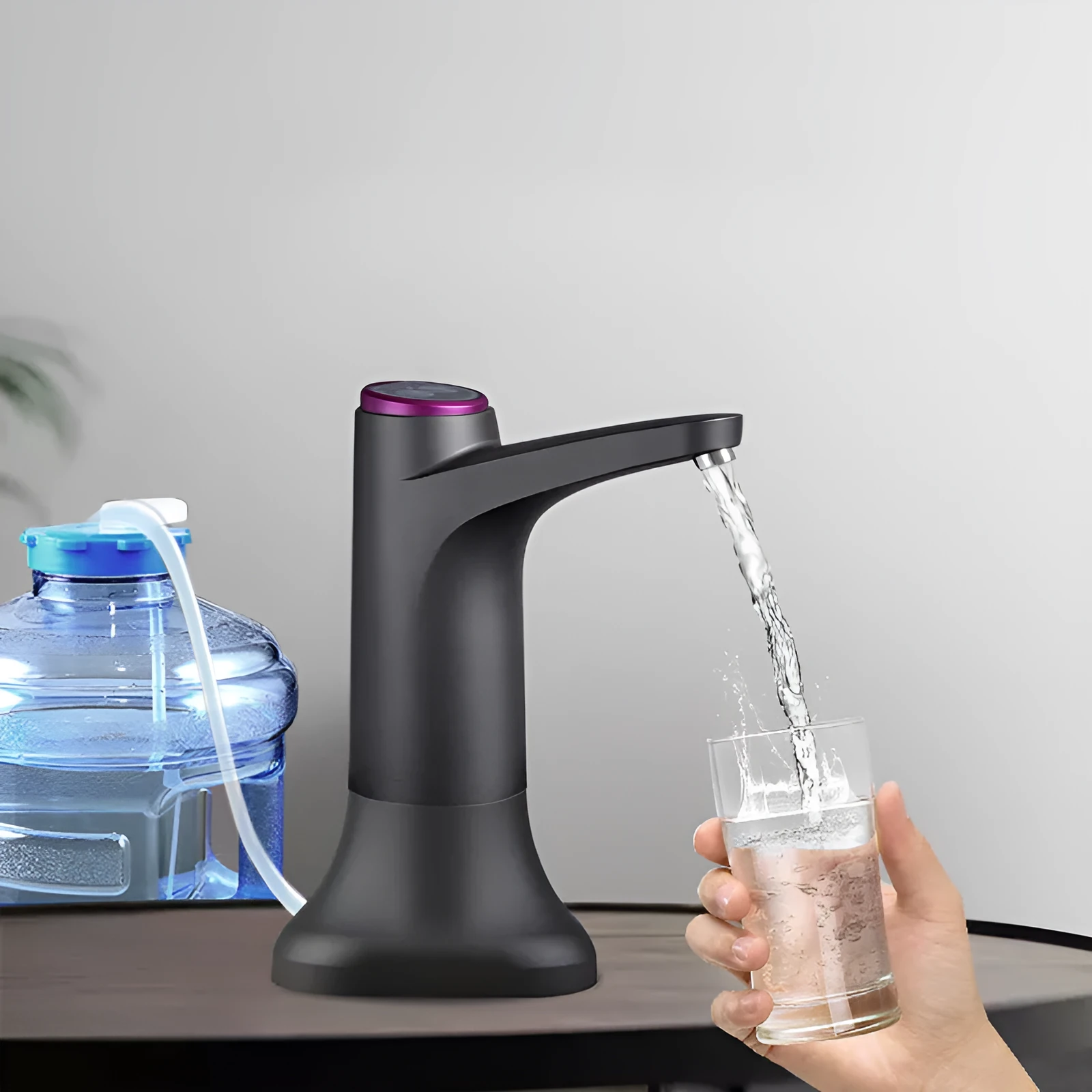 Dark grey touch automatic water dispenser on a kitchen countertop with soft hose and USB cable