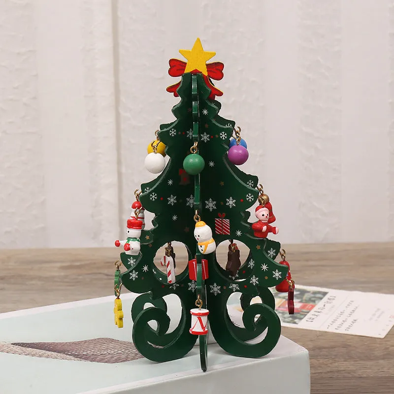 Green MDF Christmas tree ornament with laser-cut detail, 19x10.5cm, on a tree branch