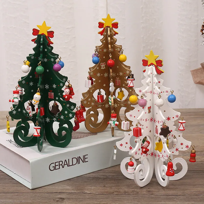 Green MDF Christmas tree ornament with laser-cut detail, 19x10.5cm, on a tree branch