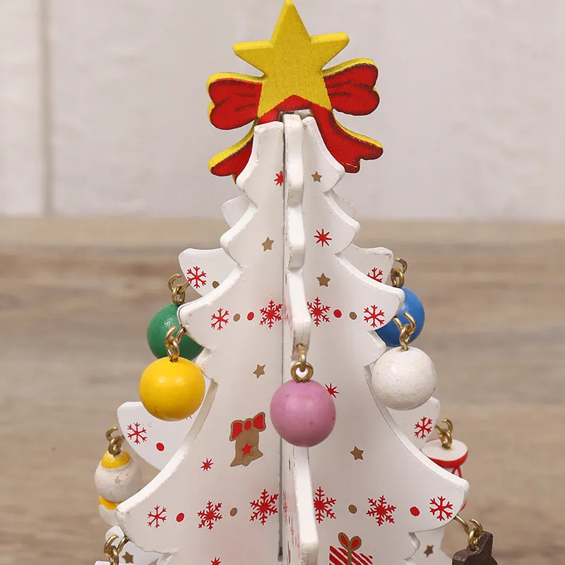 Green MDF Christmas tree ornament with laser-cut detail, 19x10.5cm, on a tree branch