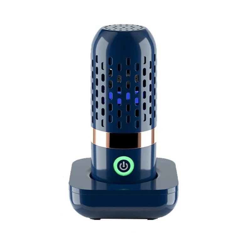 Blue capsule fruit and vegetable purifier with mechanical button and USB charging, placed in water