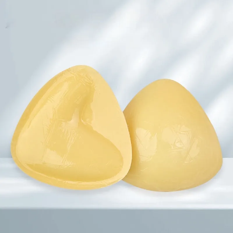 Double sided adhesive silicone bra inserts for push up lift in nude shades, reusable and water resistant