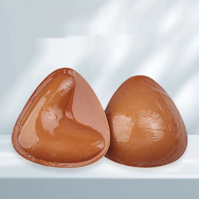 Double sided adhesive silicone bra inserts for push up lift in nude shades, reusable and water resistant