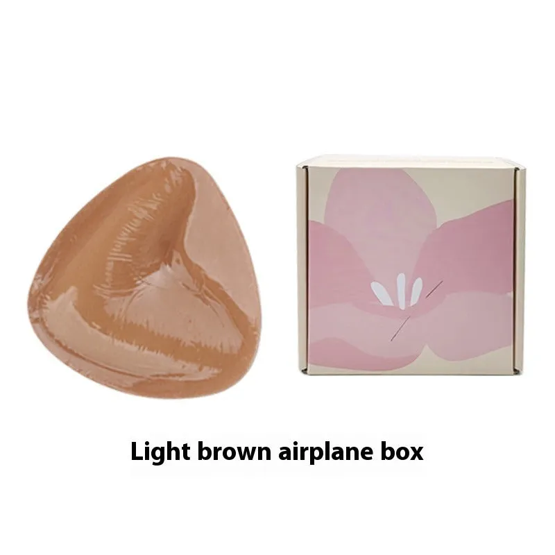Double sided adhesive silicone bra inserts for push up lift in nude shades, reusable and water resistant