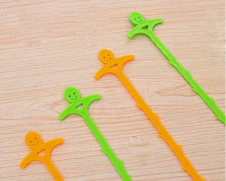 Orange colour kitchen pipe dredging hook made from soft PP, 51 cm long, with a smiling face design